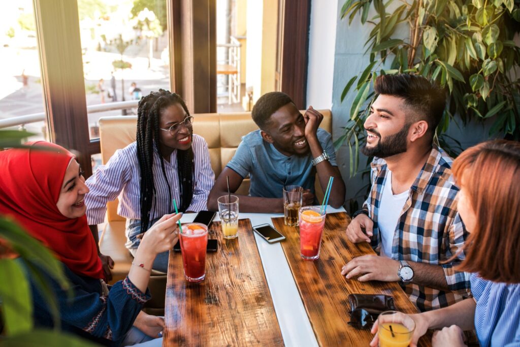 Group of happy friends celebrating good mental health after trying therapy near me